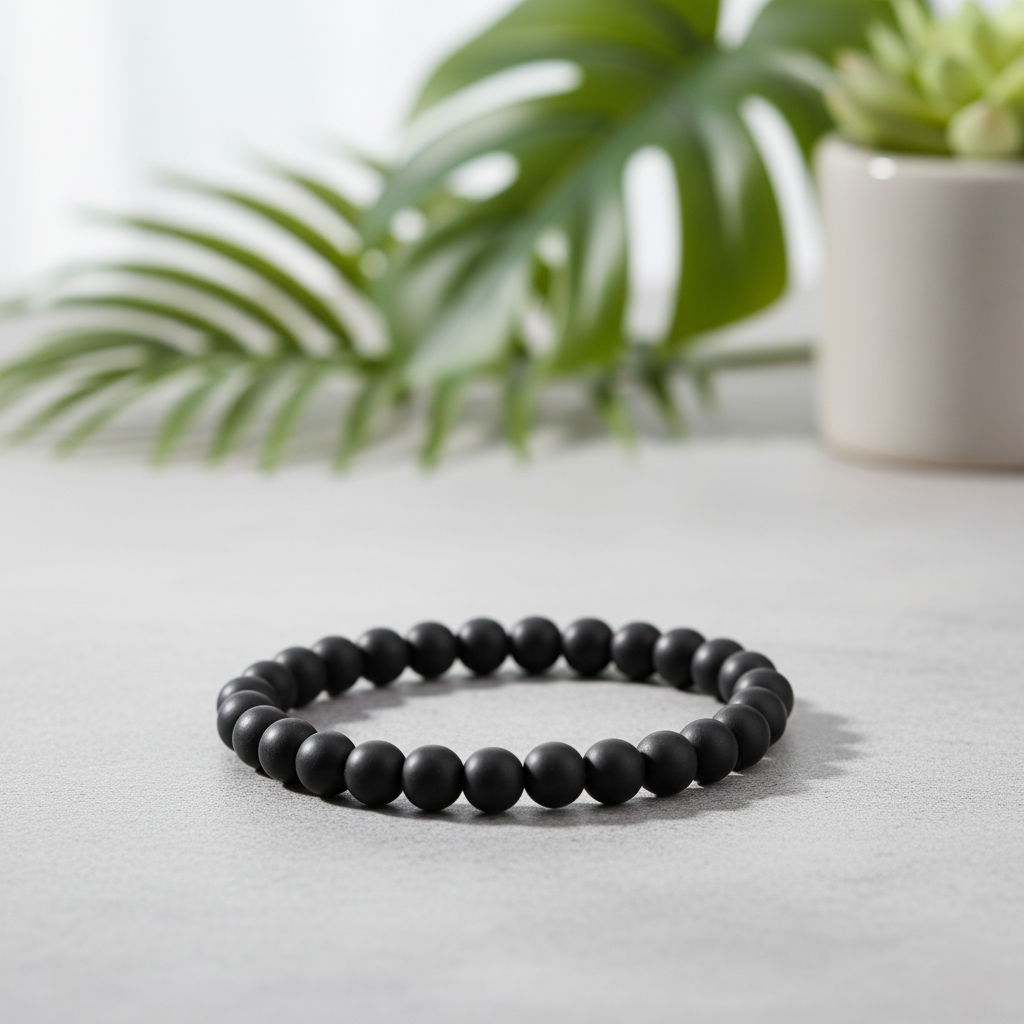 Karungali Bracelet on a smooth surface surrounded by greenery, symbolizing protection and prosperity.