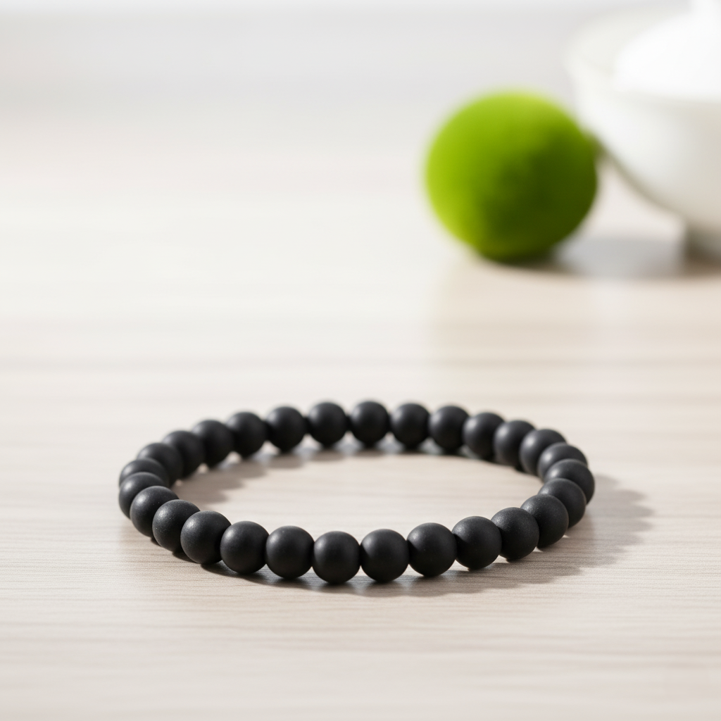 Karungali Bracelet for Protection, Prosperity & Spiritual Power on a wooden surface.