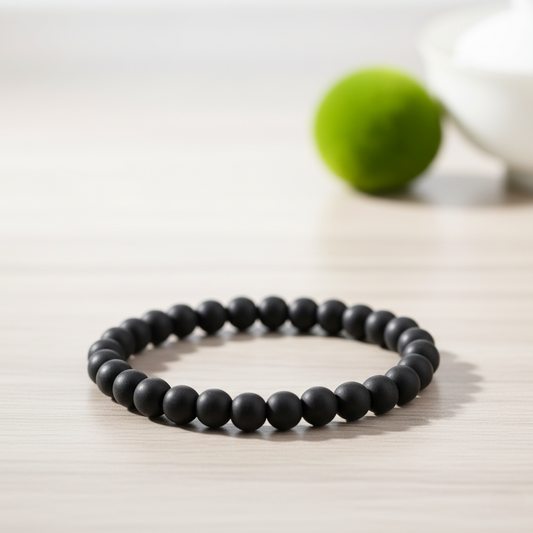 Karungali Bracelet for Protection, Prosperity & Spiritual Power on a wooden surface.